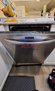 A stainless steel GE dishwasher that was having issues opening and closing in Vancouver.