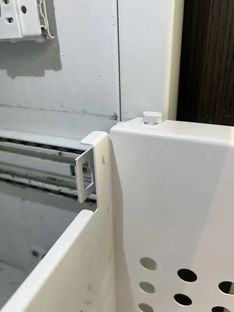 Thermador freezer basket next to the door support bracket during the repair