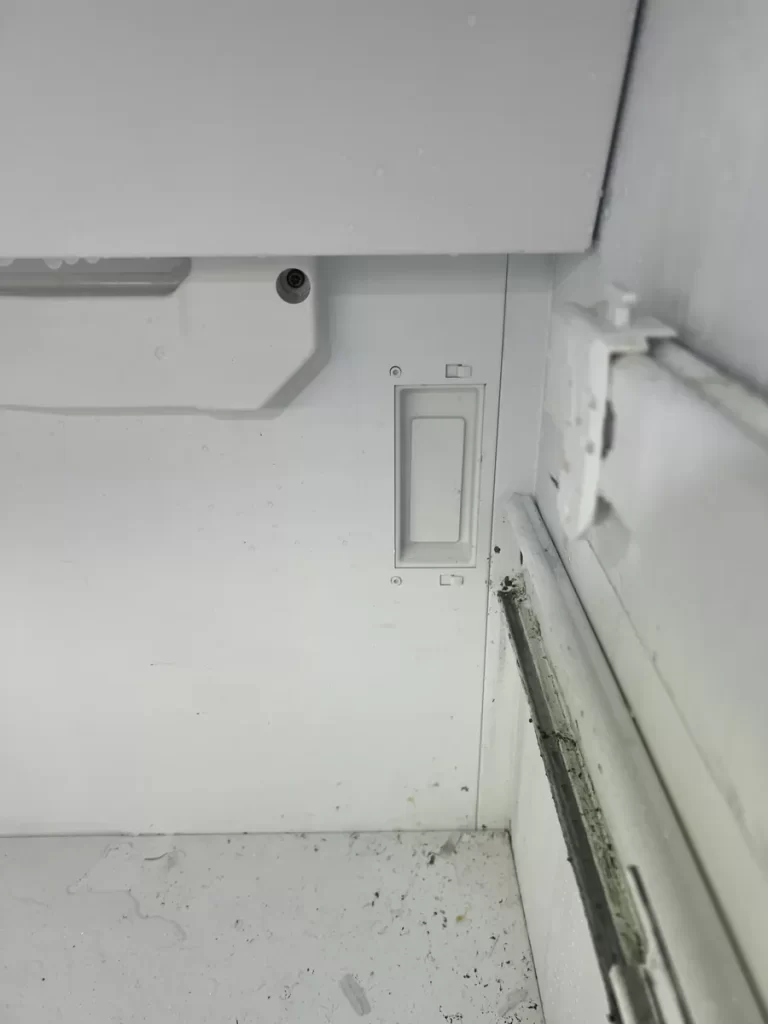 Inside the Thermador freezer compartment with the door switch housing on the back wall and the right-hand slide