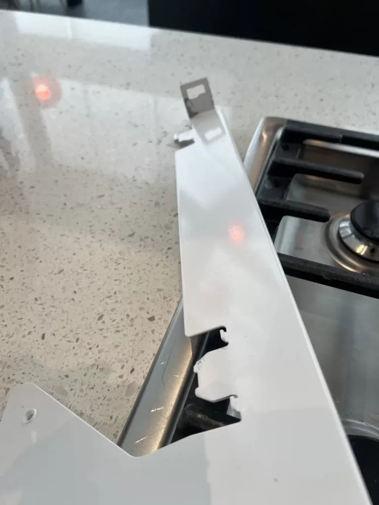 Right-side freezer door support bracket for a Thermador fridge on a kitchen counter in Coquitlam